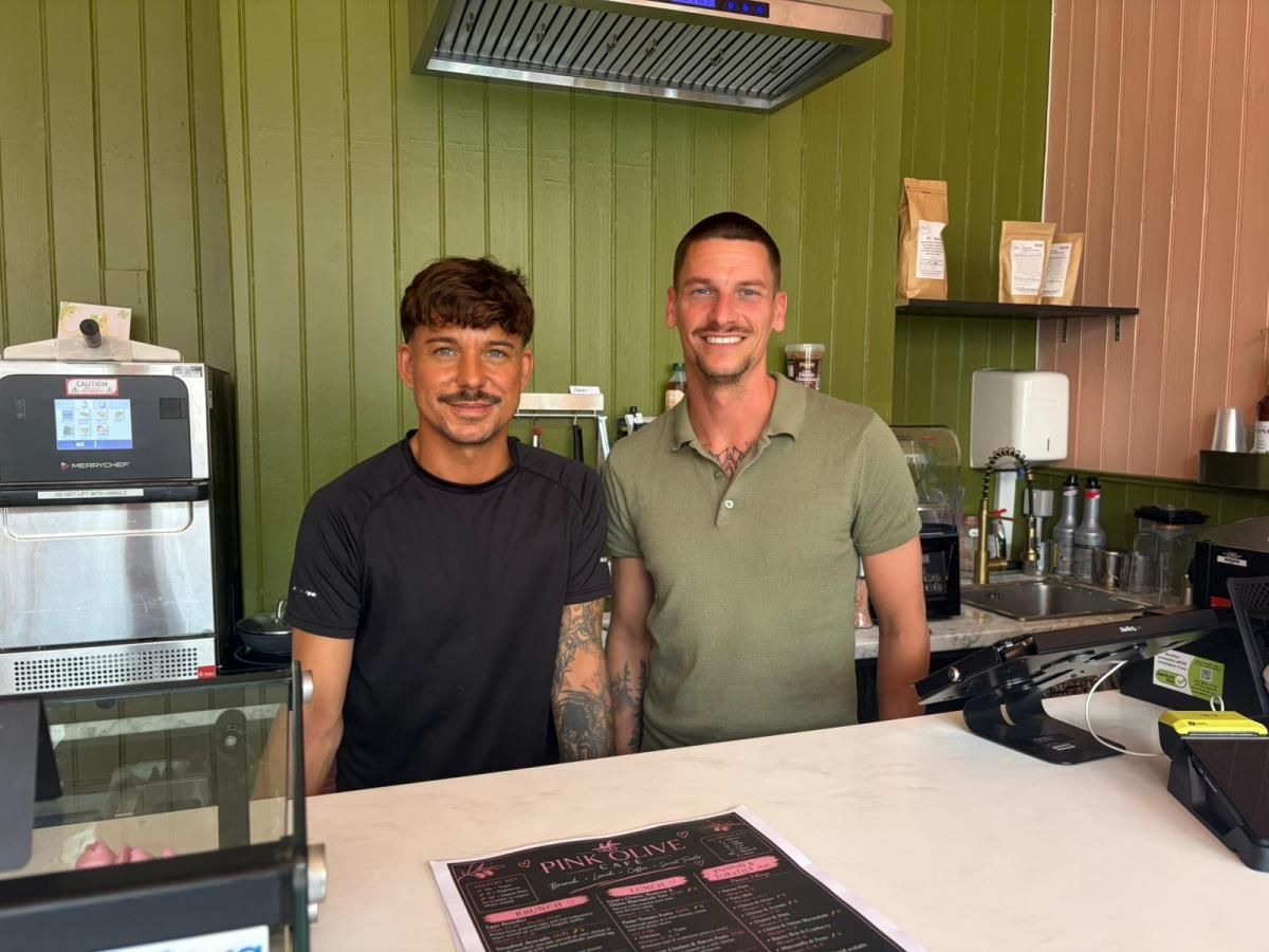 Will and Tom, managers of The Pink Olive, behind the counter